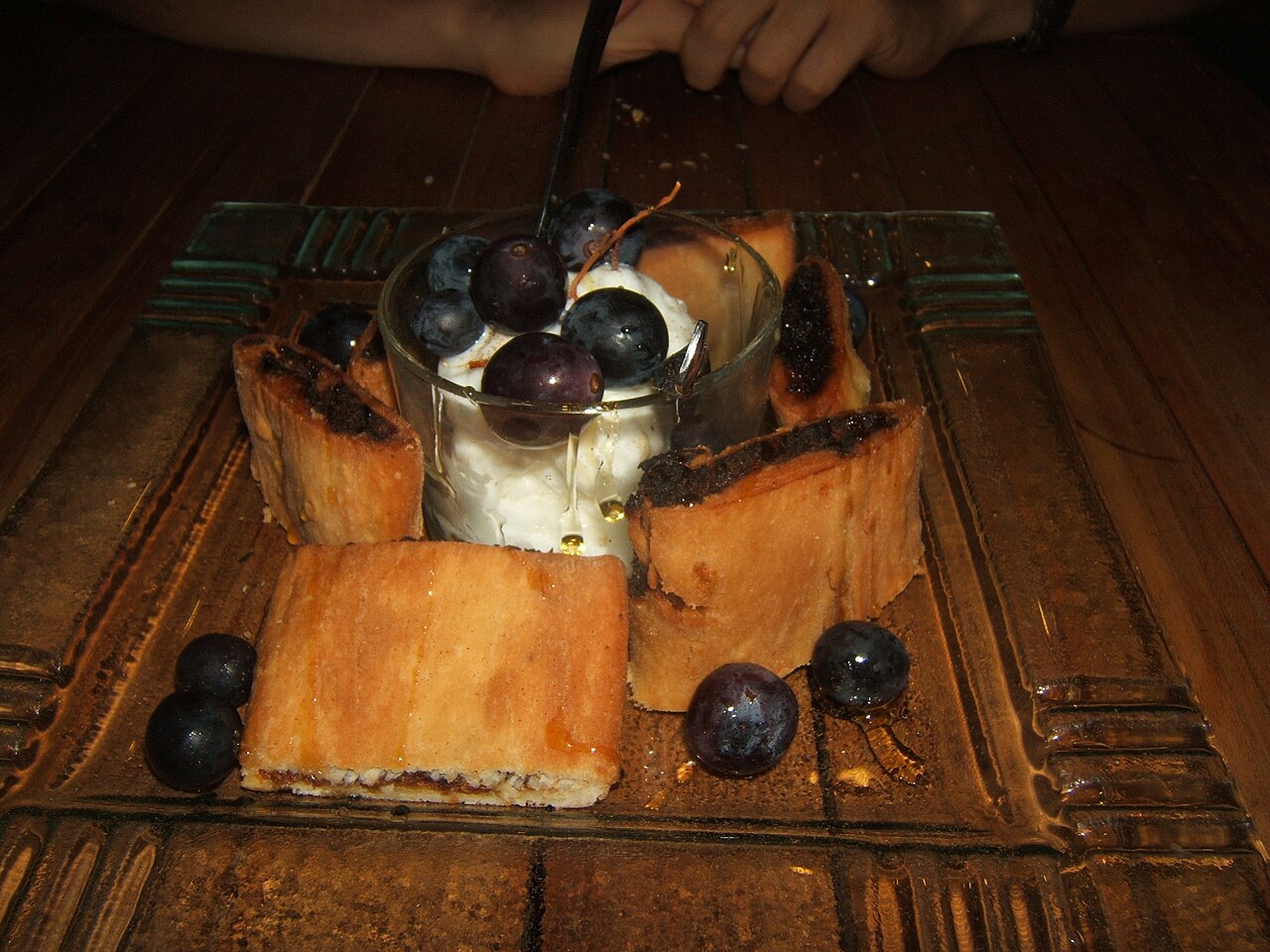 Imqaret traditional Maltese date pastry served with ice cream