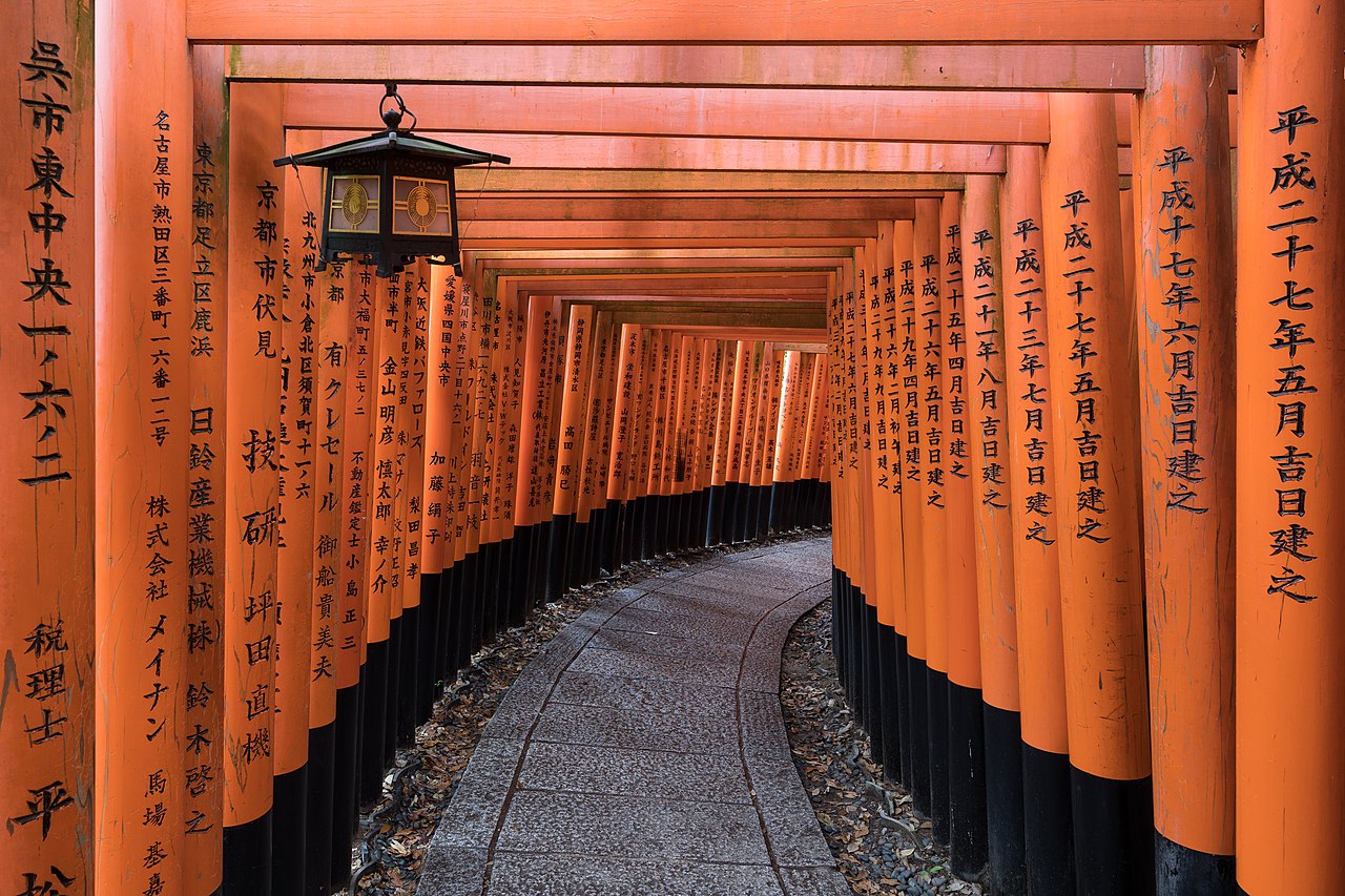 Red torii gate path at Fushimi Inari Shrine, Kyoto, Japan