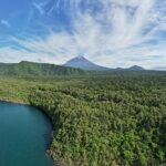 Mount Fuji rising over Lake Saiko, Japan — aerial panorama