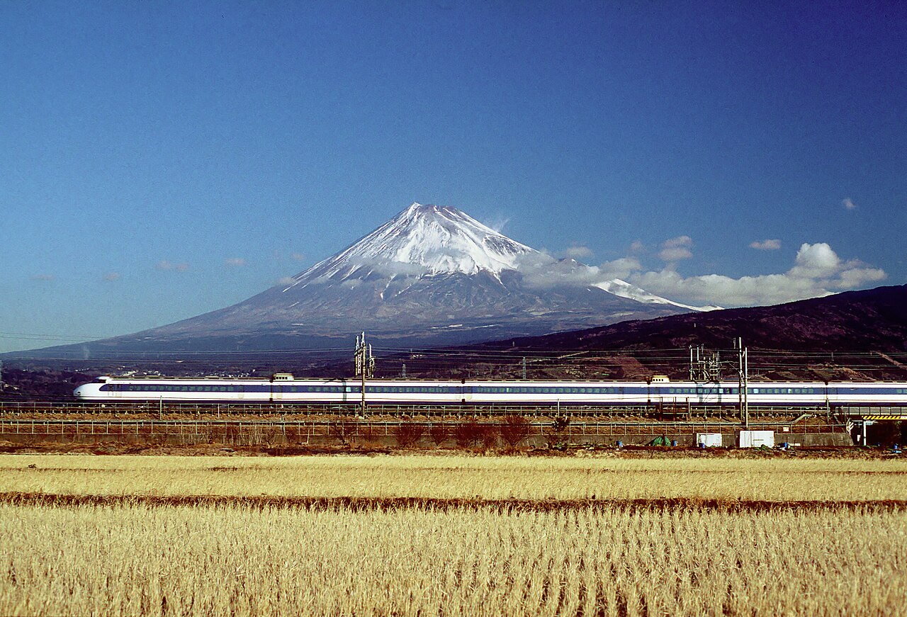 Shinkansen bullet train passing Mount Fuji, Japan