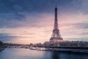The Eiffel Tower in Paris, France, seen across the Seine at golden hour