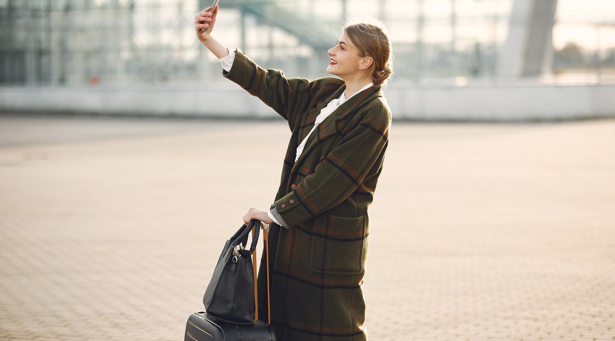 Traveler using a smartphone with mobile data while abroad